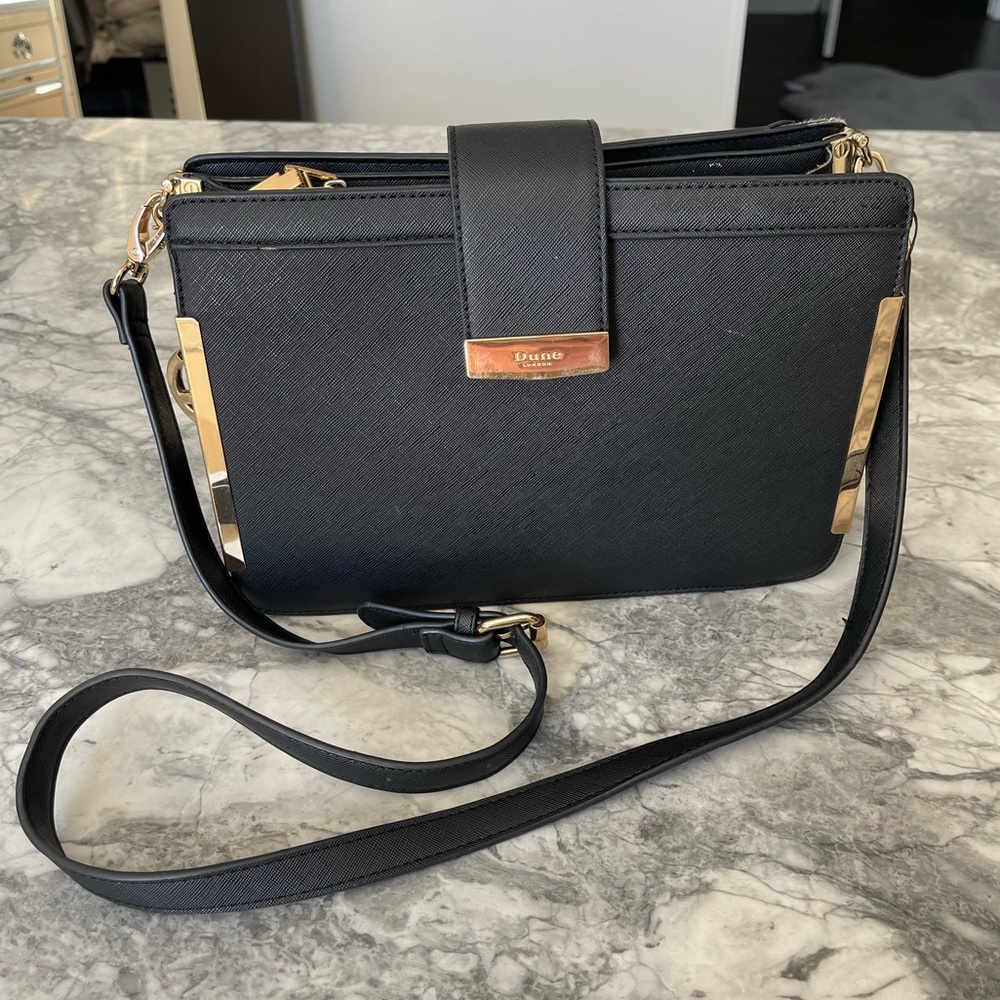Dune black & gold Crossbody Bag with a bag charm. Apr. 8.5in by 11in by 5in